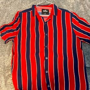 Holistic shirt blue and red stripe shirt.